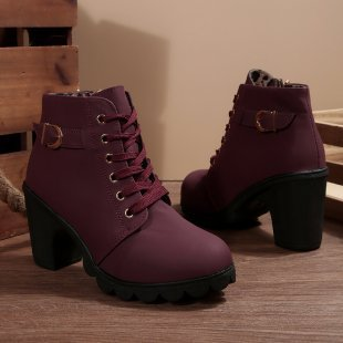 Black ankle boots featuring a lace-up design and metal buckle detail, offering a stylish and edgy look. 5