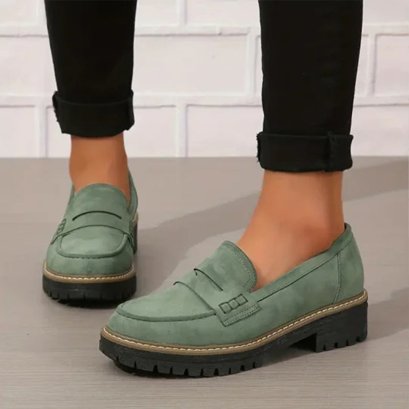 Soft blue moccasins with an ergonomic sole and wedge design, offering a casual and comfortable style. 1