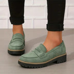 Soft blue moccasins with an ergonomic sole and wedge design, offering a casual and comfortable style. 1