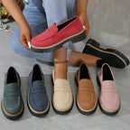 Soft blue moccasins with an ergonomic sole and wedge design, offering a casual and comfortable style. 2