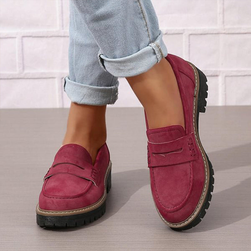 Soft blue moccasins with an ergonomic sole and wedge design, offering a casual and comfortable style. 4