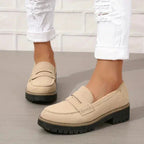 Soft blue moccasins with an ergonomic sole and wedge design, offering a casual and comfortable style. 6