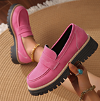 Soft blue moccasins with an ergonomic sole and wedge design, offering a casual and comfortable style. 9