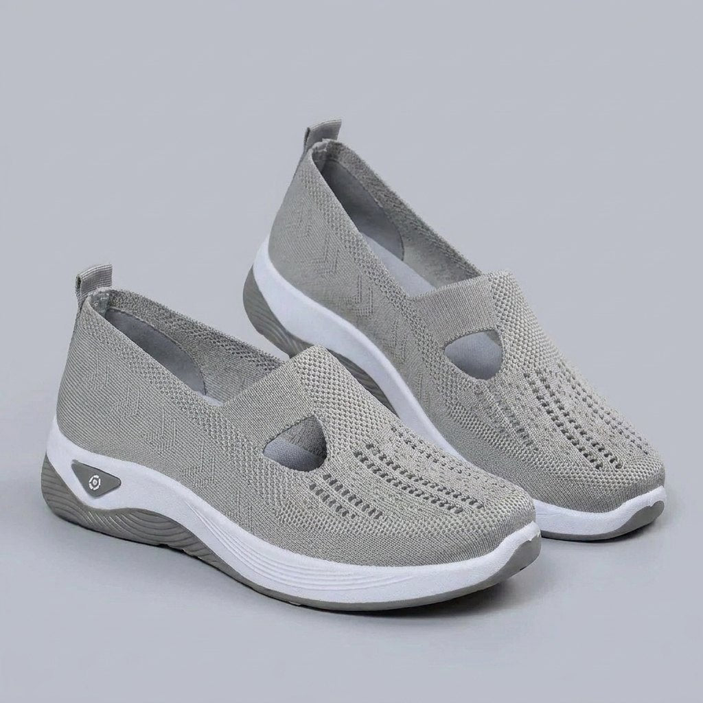 Light grey breathable mesh slip-on shoes with a casual orthopedic style for women. 1