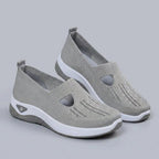 Light grey breathable mesh slip-on shoes with a casual orthopedic style for women. 1