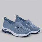 Light grey breathable mesh slip-on shoes with a casual orthopedic style for women. 7