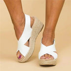 Soft leather women's sandals in tan with adjustable cross straps for a comfortable, casual look. 1