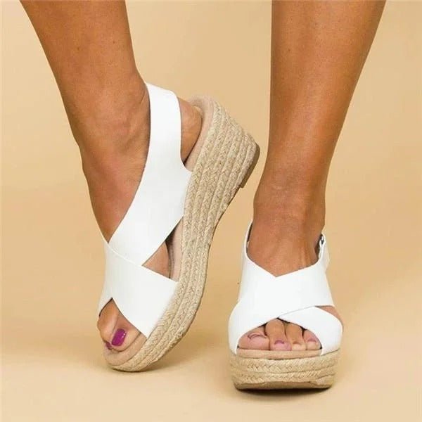 Soft leather women's sandals in tan with adjustable cross straps for a comfortable, casual look. 1