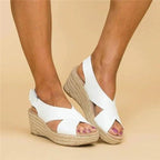 Soft leather women's sandals in tan with adjustable cross straps for a comfortable, casual look. 2