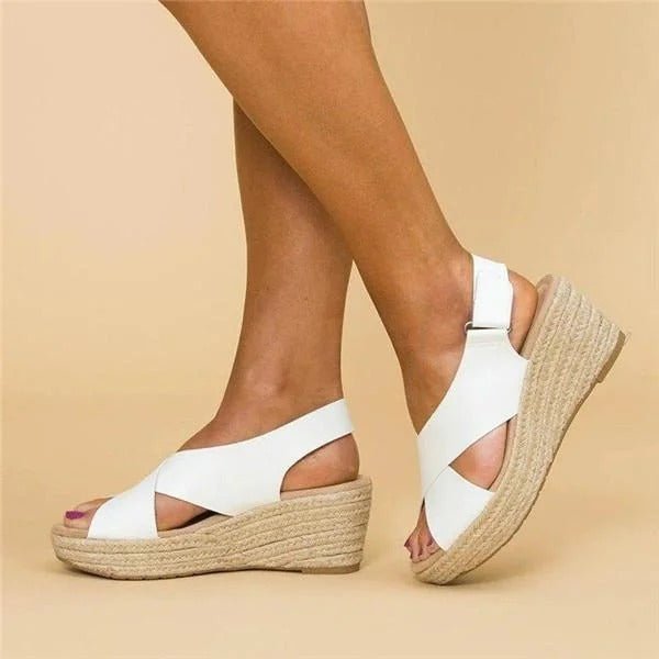 Soft leather women's sandals in tan with adjustable cross straps for a comfortable, casual look. 3