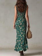 Floral maxi dress in soft pastel colors with a flowing silhouette and delicate ruffle details. 2