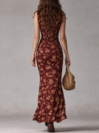 Floral maxi dress in soft pastel colors with a flowing silhouette and delicate ruffle details. 5