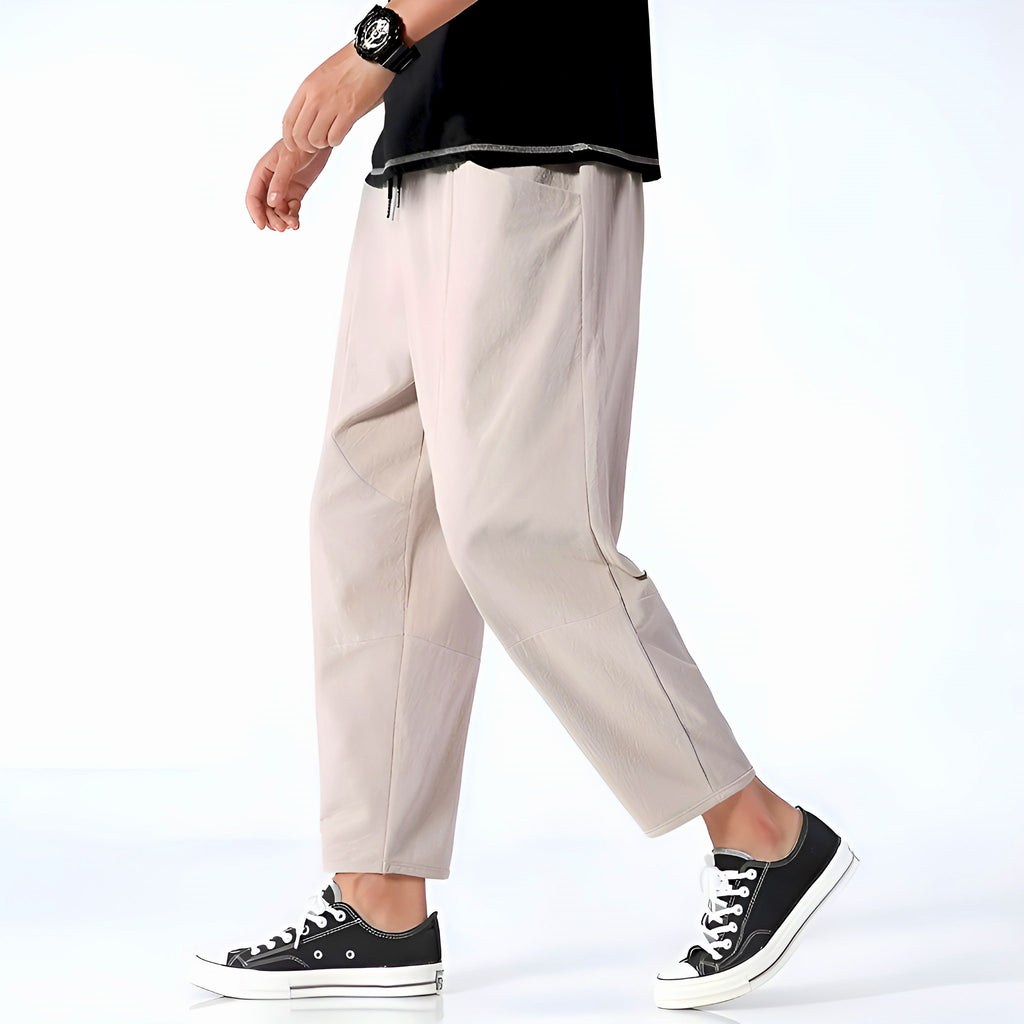 Light beige cropped pants in a relaxed fit, made from a soft cotton-linen blend, featuring a drawstring waist. 0