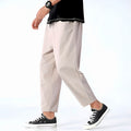 Light beige cropped pants in a relaxed fit, made from a soft cotton-linen blend, featuring a drawstring waist. 0
