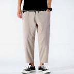 Light beige cropped pants in a relaxed fit, made from a soft cotton-linen blend, featuring a drawstring waist. 2