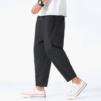 Light beige cropped pants in a relaxed fit, made from a soft cotton-linen blend, featuring a drawstring waist. 4