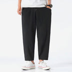 Light beige cropped pants in a relaxed fit, made from a soft cotton-linen blend, featuring a drawstring waist. 5