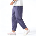 Light beige cropped pants in a relaxed fit, made from a soft cotton-linen blend, featuring a drawstring waist. 9