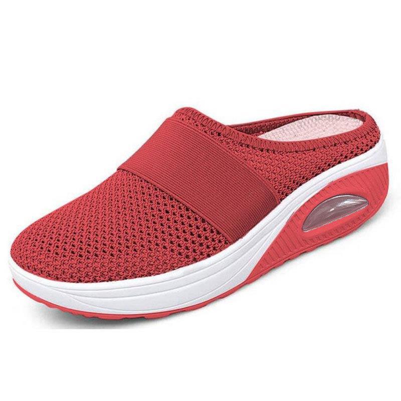 Light grey slip-on mules with a breathable upper and cushioned sole for casual comfort. 0