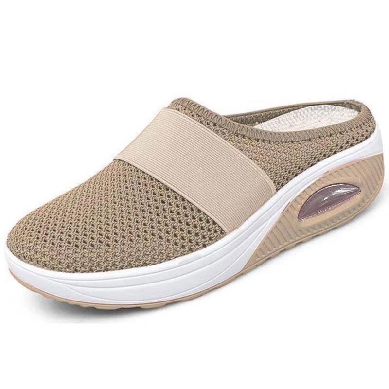 Light grey slip-on mules with a breathable upper and cushioned sole for casual comfort. 3