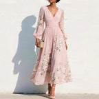 Ella floral midi dress in soft pink, featuring a V neckline and a flowing, feminine silhouette. 1