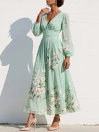 Ella floral midi dress in soft pink, featuring a V neckline and a flowing, feminine silhouette. 4