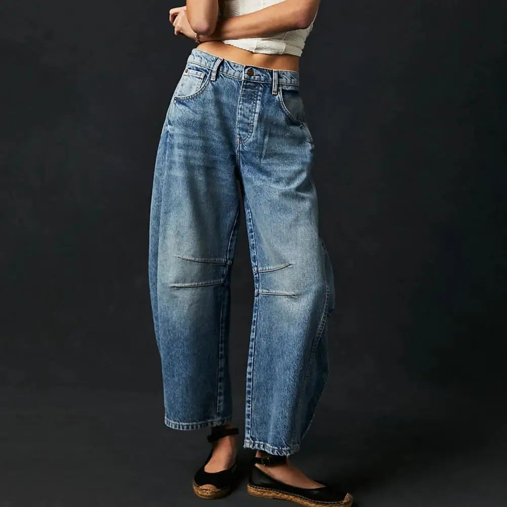 Light blue wide-leg jeans with a relaxed fit, featuring a classic five-pocket style and frayed hem. 10