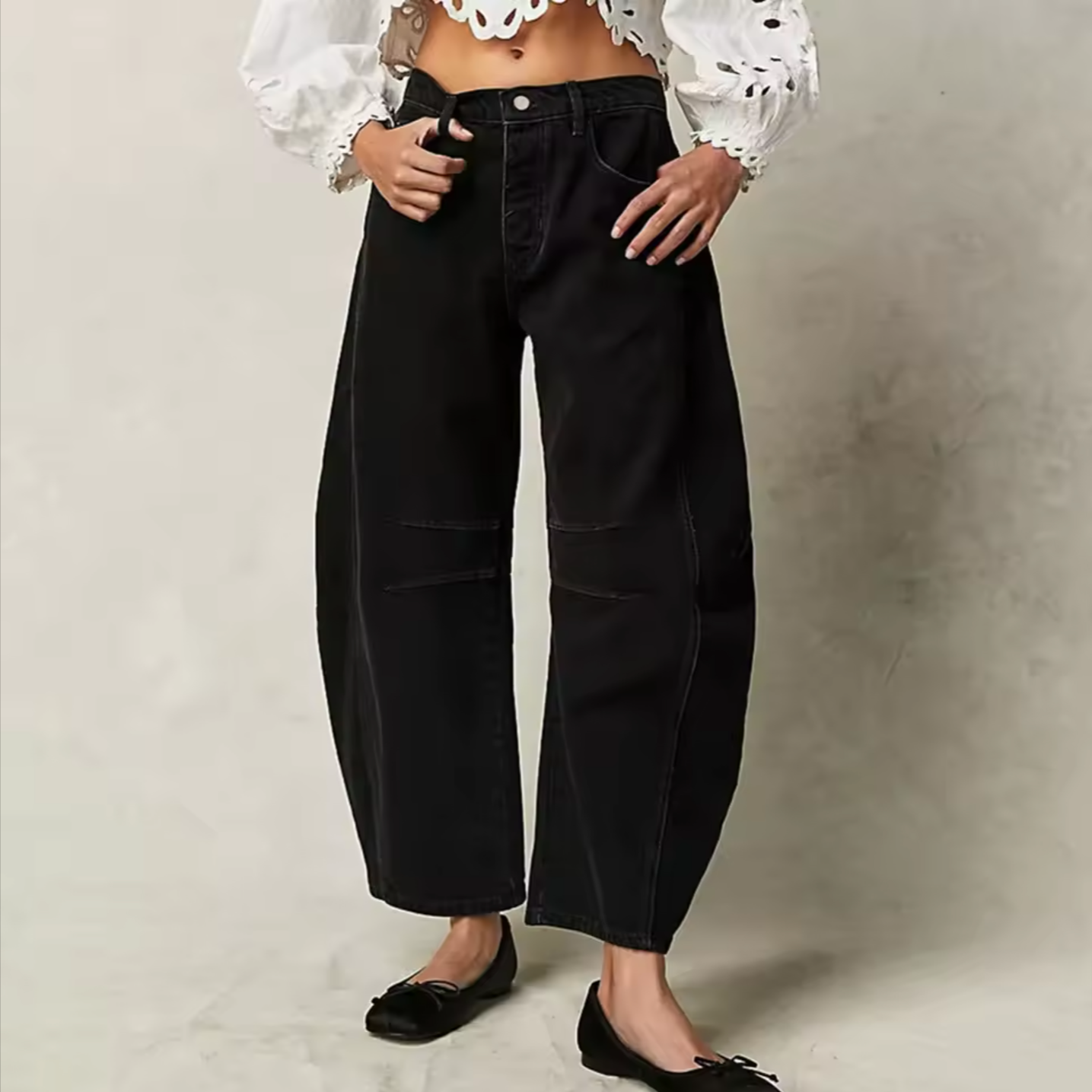 Light blue wide-leg jeans with a relaxed fit, featuring a classic five-pocket style and frayed hem. 6