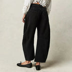 Light blue wide-leg jeans with a relaxed fit, featuring a classic five-pocket style and frayed hem. 7