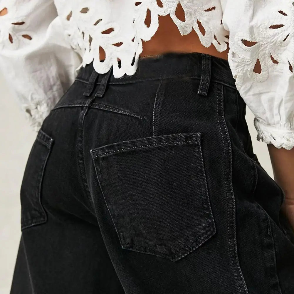 Light blue wide-leg jeans with a relaxed fit, featuring a classic five-pocket style and frayed hem. 8