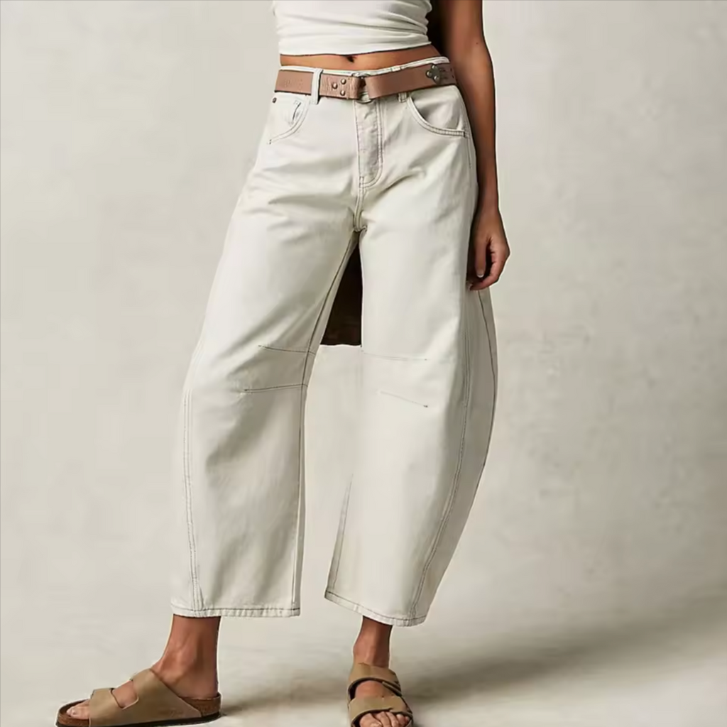 Light blue wide-leg jeans with a relaxed fit, featuring a classic five-pocket style and frayed hem. 9