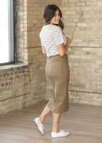 Black cotton twill midi skirt, stretchy and semi-fitted style for a comfortable and sleek look. 7