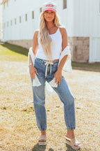 High-rise blue jogger jeans with a drawstring and pockets, featuring a relaxed fit and casual style. 1