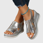 Light pink women's sandals with a casual style, featuring a slip-resistant grip and cushioned footbed. 1