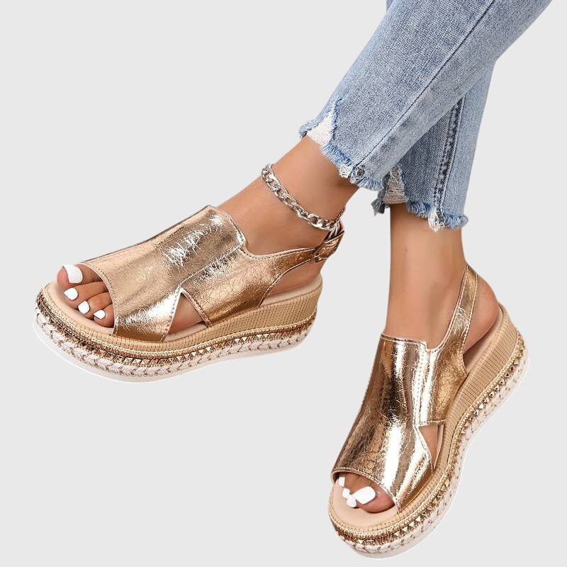 Light pink women's sandals with a casual style, featuring a slip-resistant grip and cushioned footbed. 2