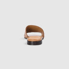 Tan leather sandals with a soft square toe and intricate laser-cut pattern. 4