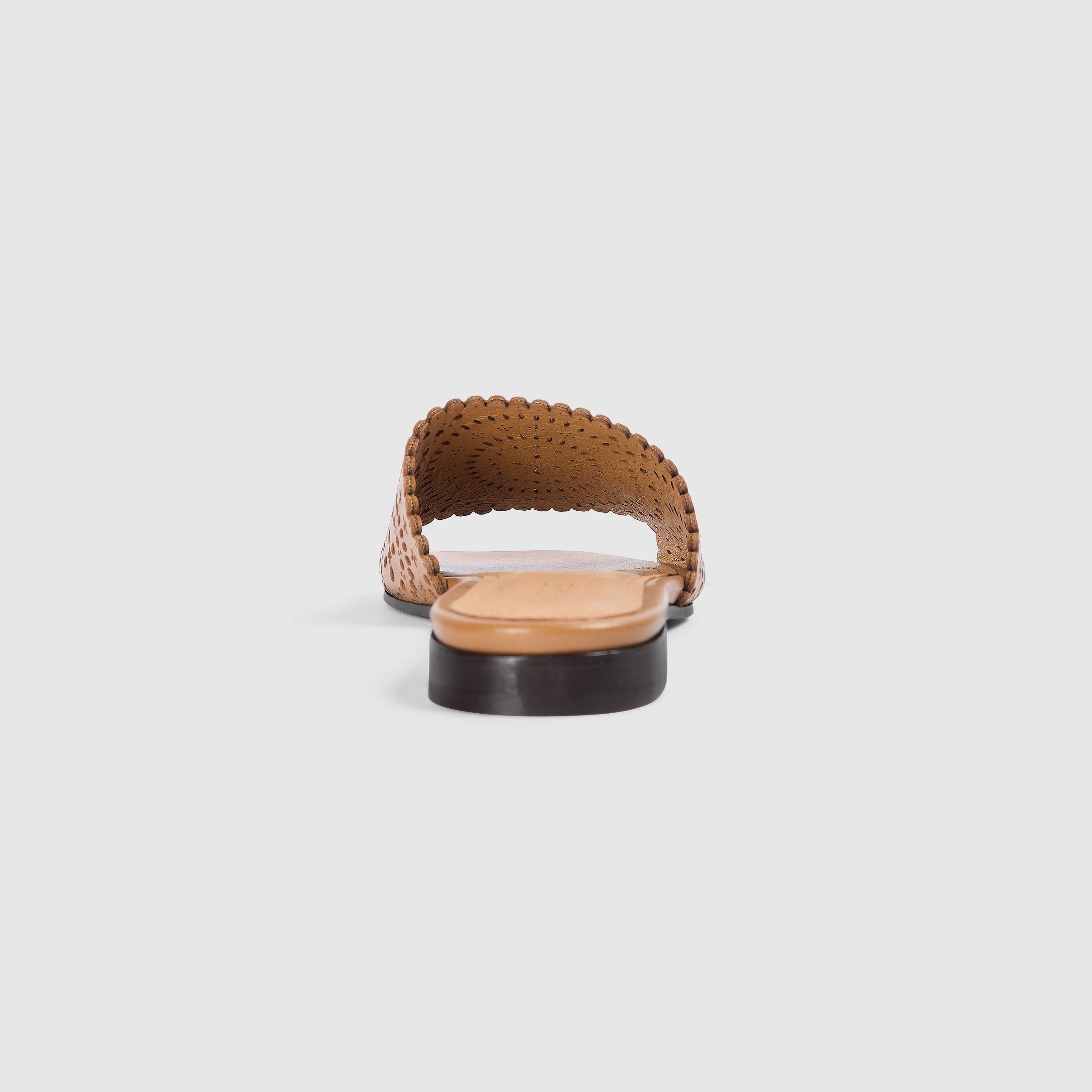 Tan leather sandals with a soft square toe and intricate laser-cut pattern. 4