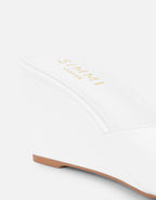 Iris wedge mules in a soft beige color with a simple, contemporary design. 2