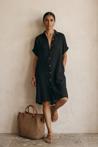 Black linen midi dress with a relaxed fit and minimalist style. 2
