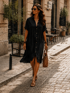 Black linen midi dress with a relaxed fit and minimalist style. 3