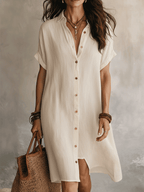 Black linen midi dress with a relaxed fit and minimalist style. 6