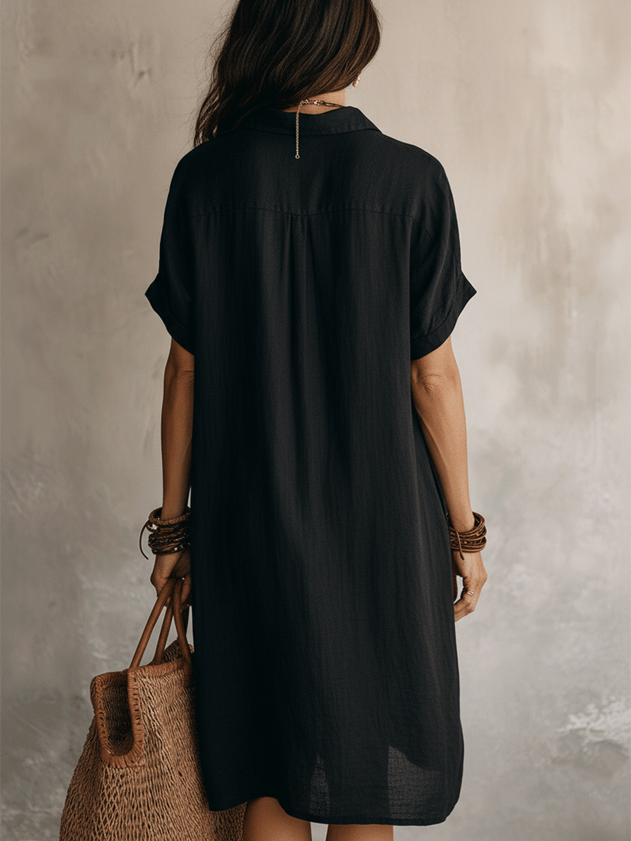 Black linen midi dress with a relaxed fit and minimalist style. 7