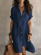 Black linen midi dress with a relaxed fit and minimalist style. 8