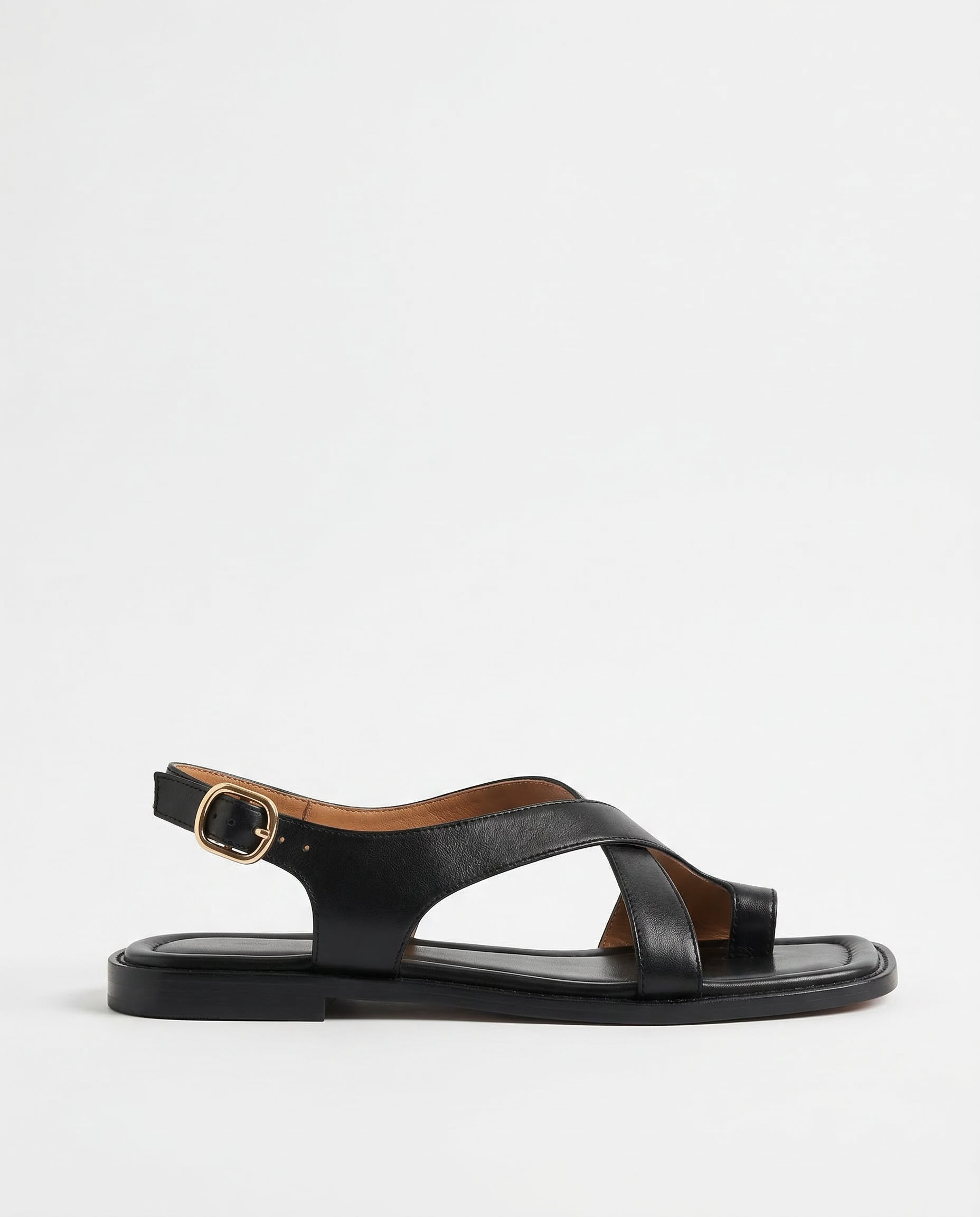 Brown leather cross sandals with a casual style, featuring a simple yet elegant design for everyday wear. 1