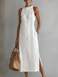 Light blue linen summer dress with a relaxed fit and adjustable straps, perfect for warm weather. 0