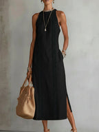 Light blue linen summer dress with a relaxed fit and adjustable straps, perfect for warm weather. 1