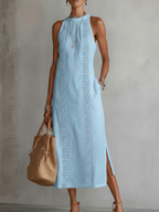 Light blue linen summer dress with a relaxed fit and adjustable straps, perfect for warm weather. 2