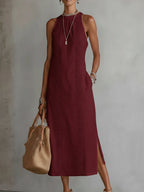 Light blue linen summer dress with a relaxed fit and adjustable straps, perfect for warm weather. 3