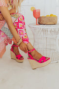 Hot pink faux leather wedge shoes featuring a 5 1/4 inch heel, combining modern style with a vibrant color. 0