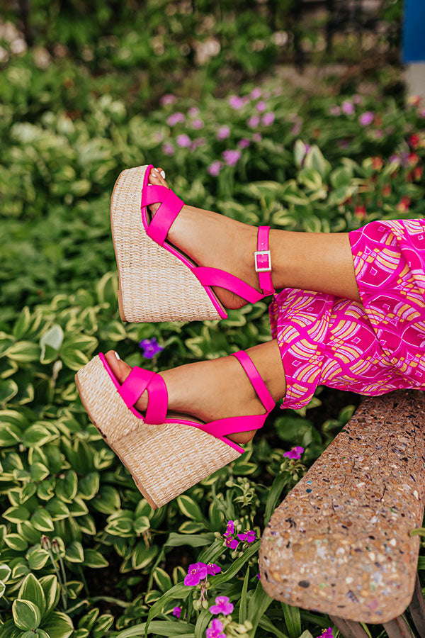 Hot pink faux leather wedge shoes featuring a 5 1/4 inch heel, combining modern style with a vibrant color. 1